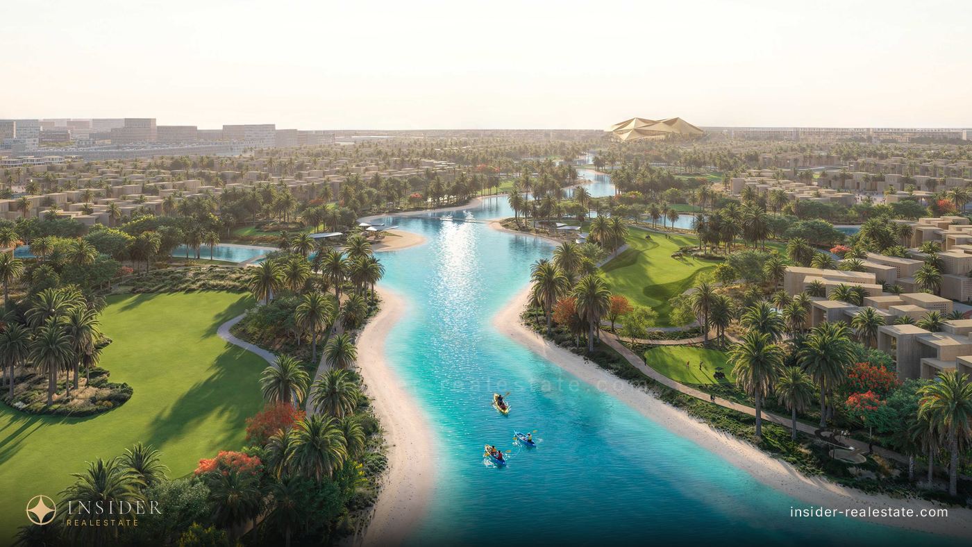 Turquoise Mira Hills lagoon between the golf course and the buildings, seen from above