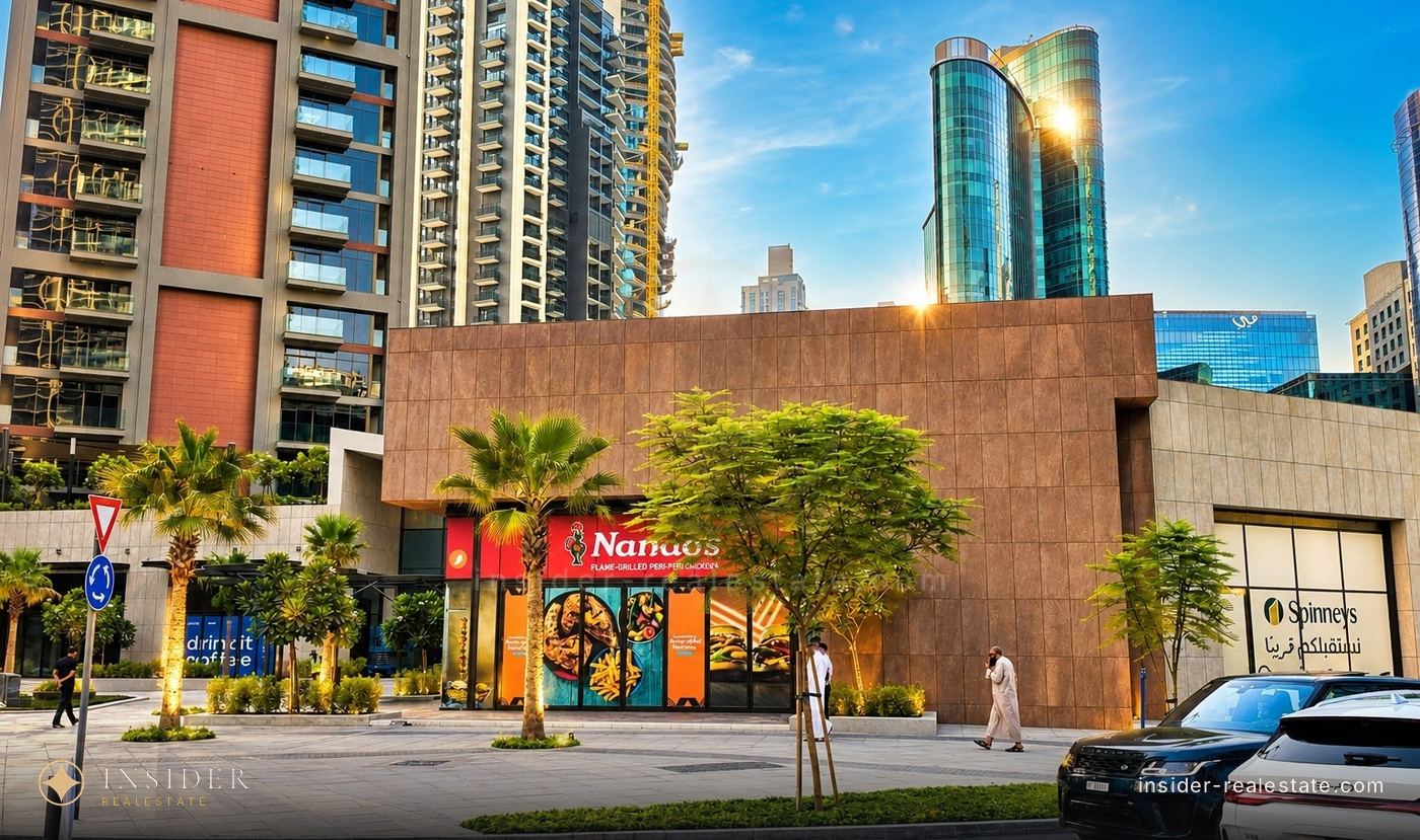 The retail podium of Peninsula Four in Business Bay: the Nando’s and Spinneys shopfronts before the mall opens
