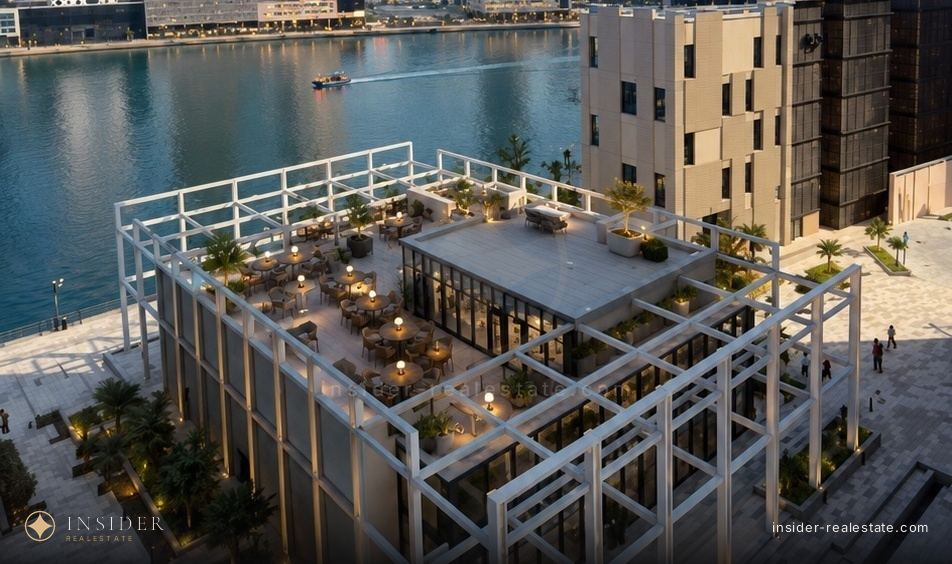 The terrace of the Market Place food hall under the Peninsula towers on the Dubai Canal